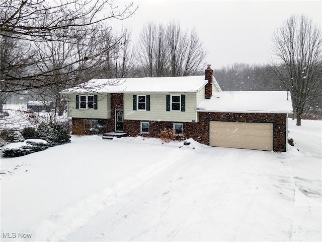 bi-level home featuring a garage