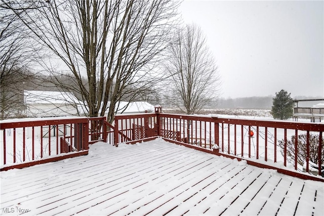 view of snow covered deck