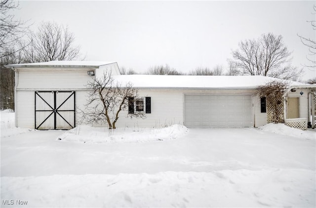 view of snow covered garage