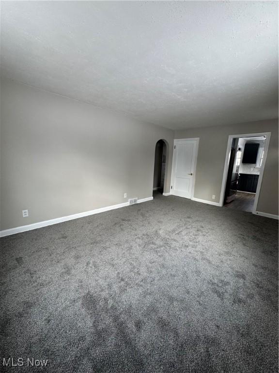 unfurnished living room with carpet