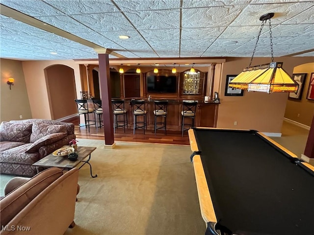 recreation room with bar area and billiards