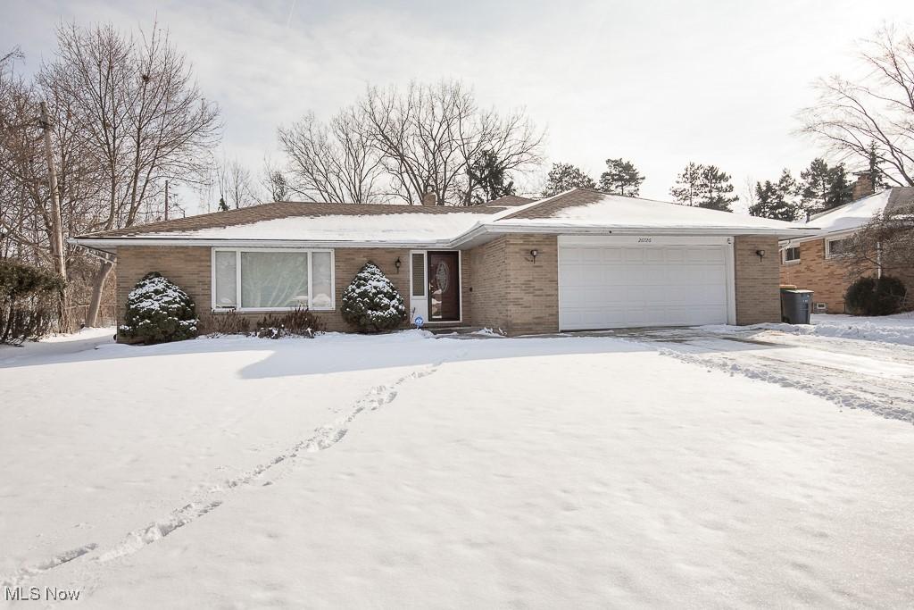 single story home with a garage