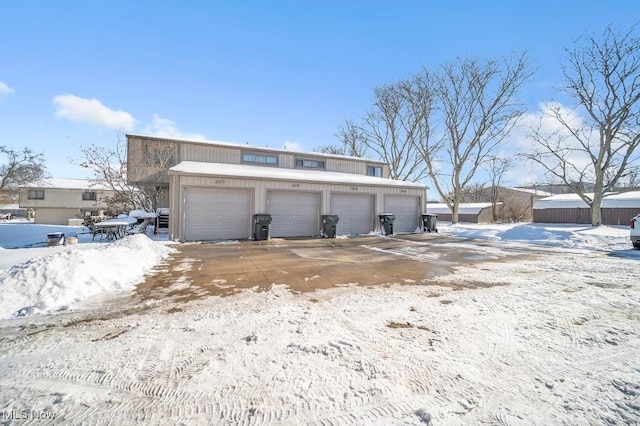 view of snow covered garage