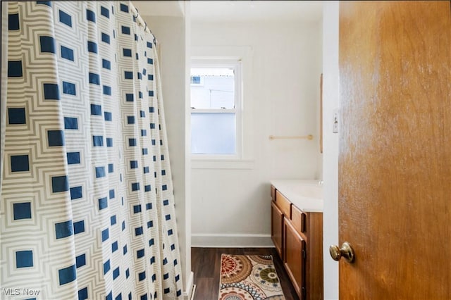 bathroom with vanity, a shower with curtain, and hardwood / wood-style floors