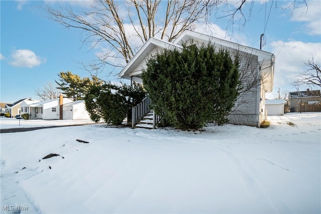 view of snow covered property