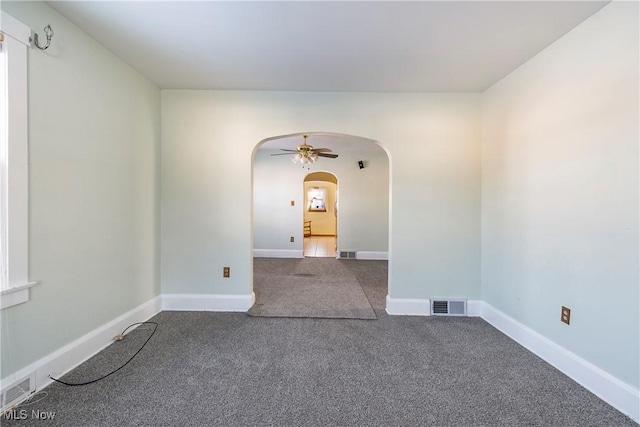 carpeted empty room with ceiling fan