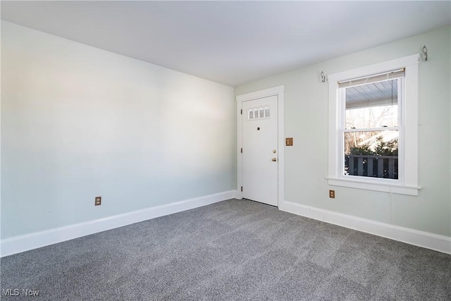 spare room featuring carpet floors