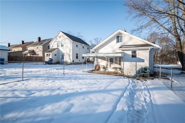 view of snow covered house