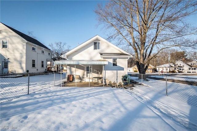 snow covered property with covered porch