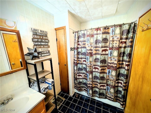 bathroom with vanity, a shower with shower curtain, and ornamental molding