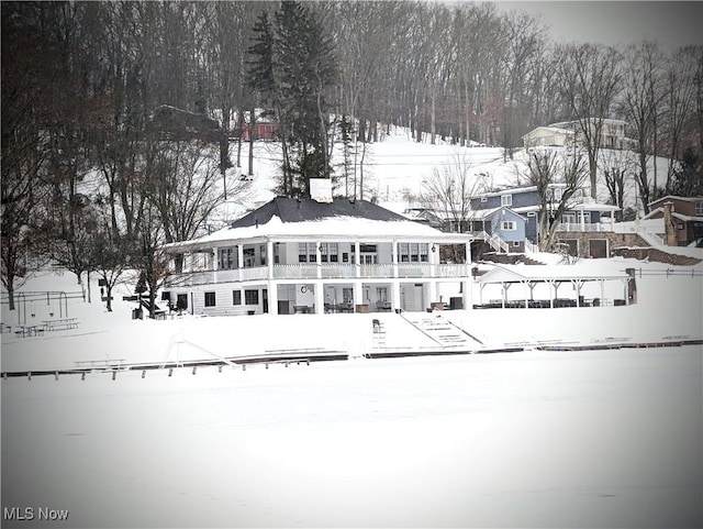 view of snow covered property