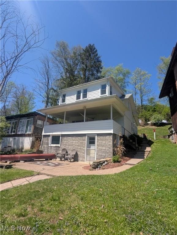 544 Maple Lake Rd, Bridgeport, WV 26330 - back of property featuring a yard, stone siding, and a patio area