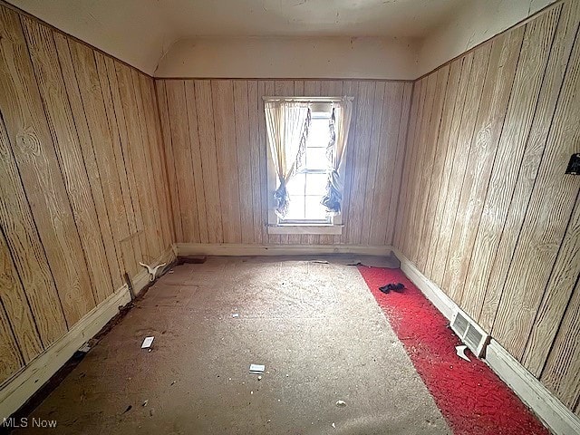 empty room with wood walls