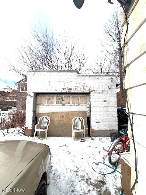 view of snow covered garage