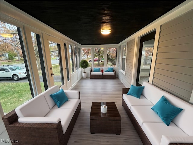 sunroom featuring wooden ceiling