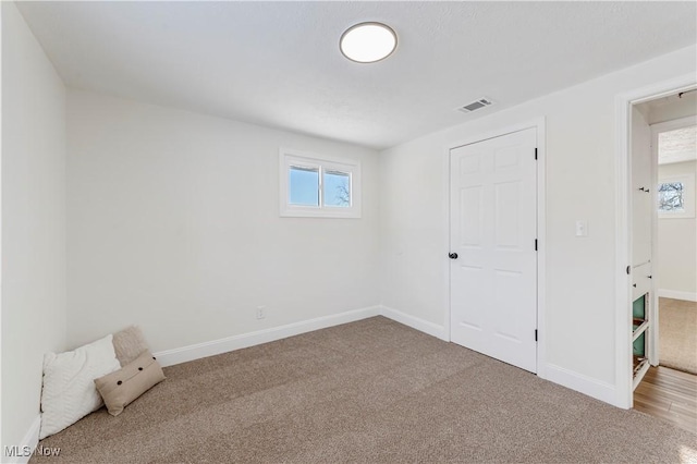 unfurnished bedroom featuring carpet