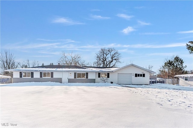 ranch-style house featuring a garage