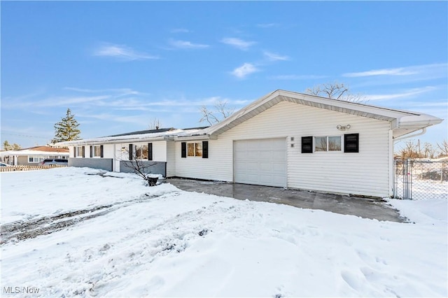 ranch-style house featuring a garage