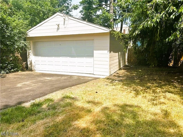 garage with a yard