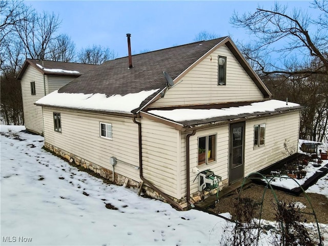 view of snow covered house