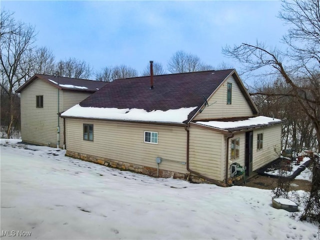 view of snow covered property