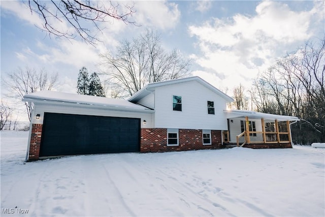 view of front of house featuring a garage and a porch