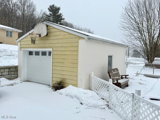 view of snow covered garage