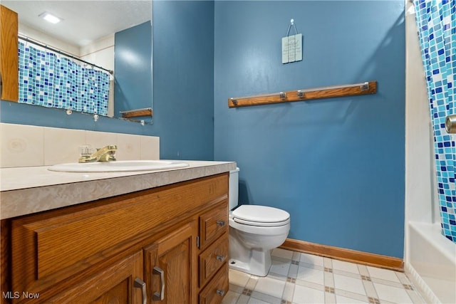 bathroom with toilet and vanity