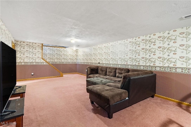 carpeted living room with a textured ceiling