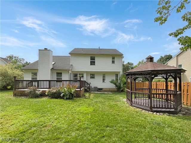 rear view of property featuring a wooden deck, a gazebo, a yard, and central air condition unit