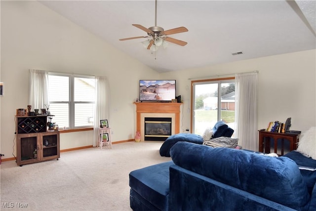 living room with ceiling fan, carpet flooring, and high vaulted ceiling