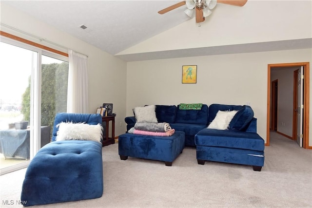 living room with light carpet, ceiling fan, and lofted ceiling