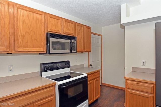 kitchen with a textured ceiling, white electric stove, and dark hardwood / wood-style flooring