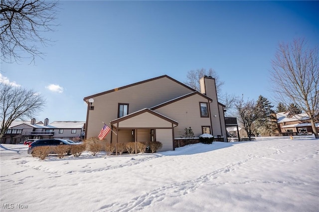 view of snow covered property