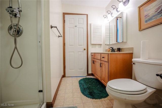 bathroom with toilet, walk in shower, and vanity