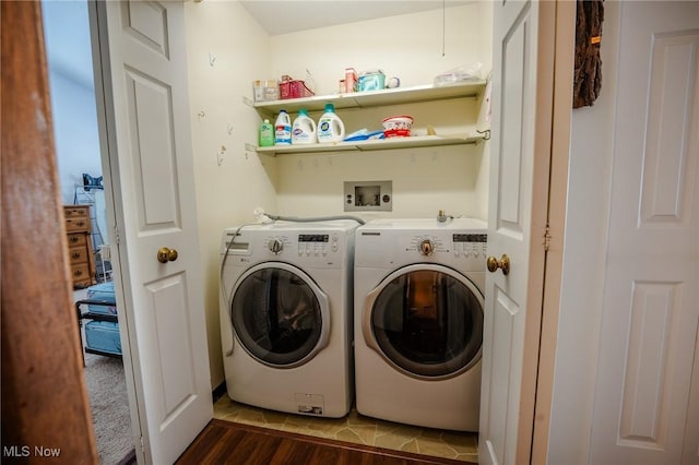 laundry room featuring wood-type flooring and washing machine and clothes dryer