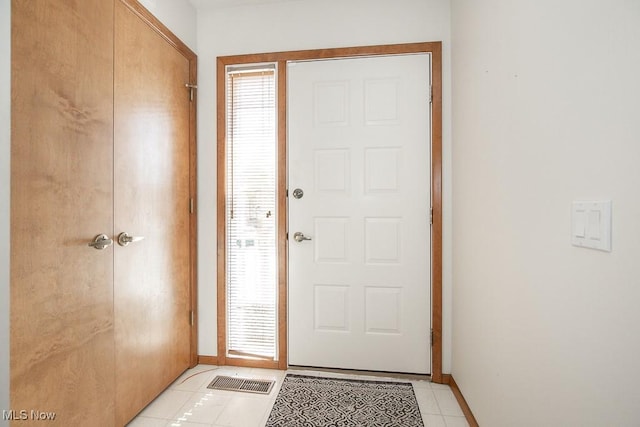 entryway with light tile patterned floors