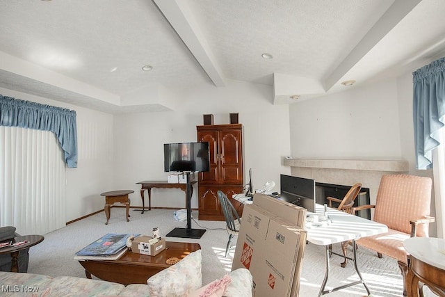 carpeted office featuring beam ceiling