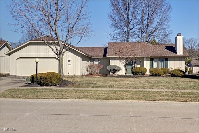 single story home with an attached garage, concrete driveway, roof with shingles, a front lawn, and a chimney