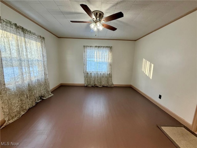 unfurnished room with ceiling fan, crown molding, and hardwood / wood-style floors