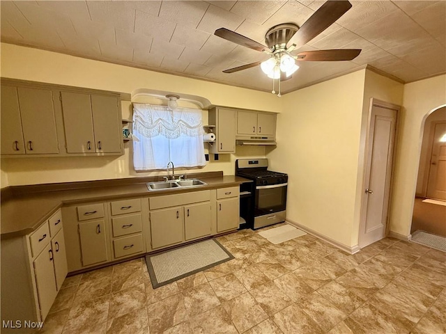 kitchen with ceiling fan, sink, and stainless steel range with gas cooktop