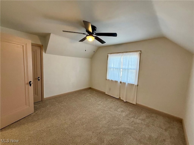 bonus room with light carpet, ceiling fan, and lofted ceiling