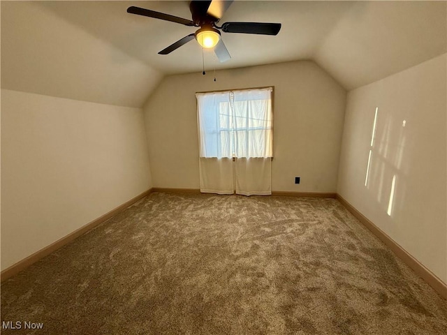 bonus room featuring ceiling fan, vaulted ceiling, and carpet