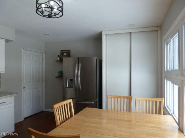 dining space featuring a notable chandelier