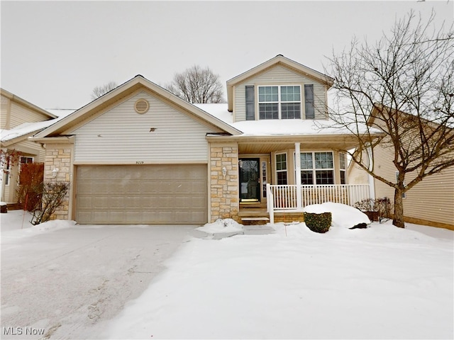 view of front of home featuring a garage and covered porch