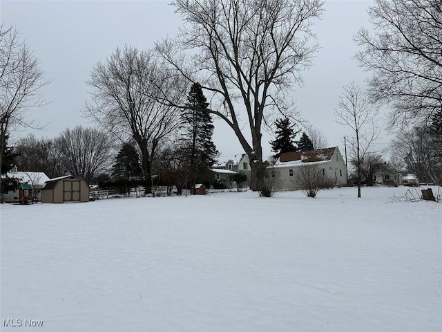 view of yard layered in snow