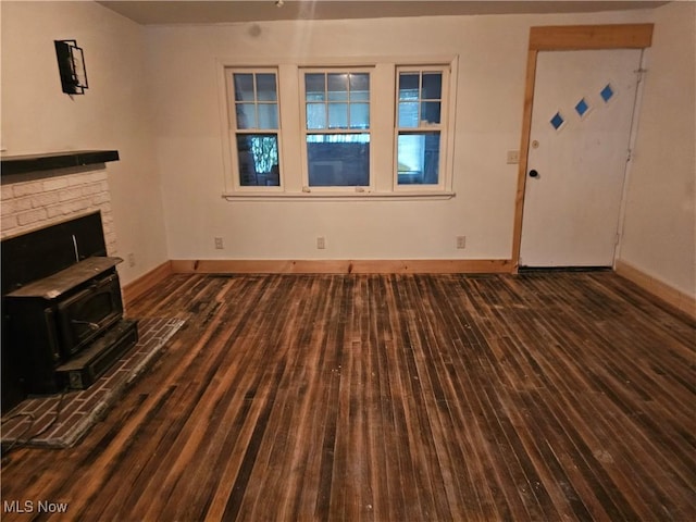 unfurnished living room featuring dark hardwood / wood-style floors