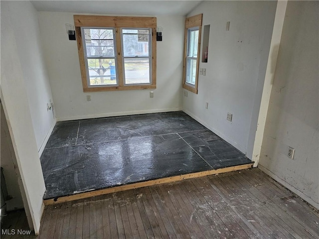 empty room featuring dark hardwood / wood-style flooring