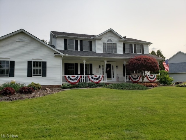 view of front of home featuring a front lawn and a porch