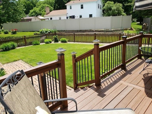 wooden terrace with a yard